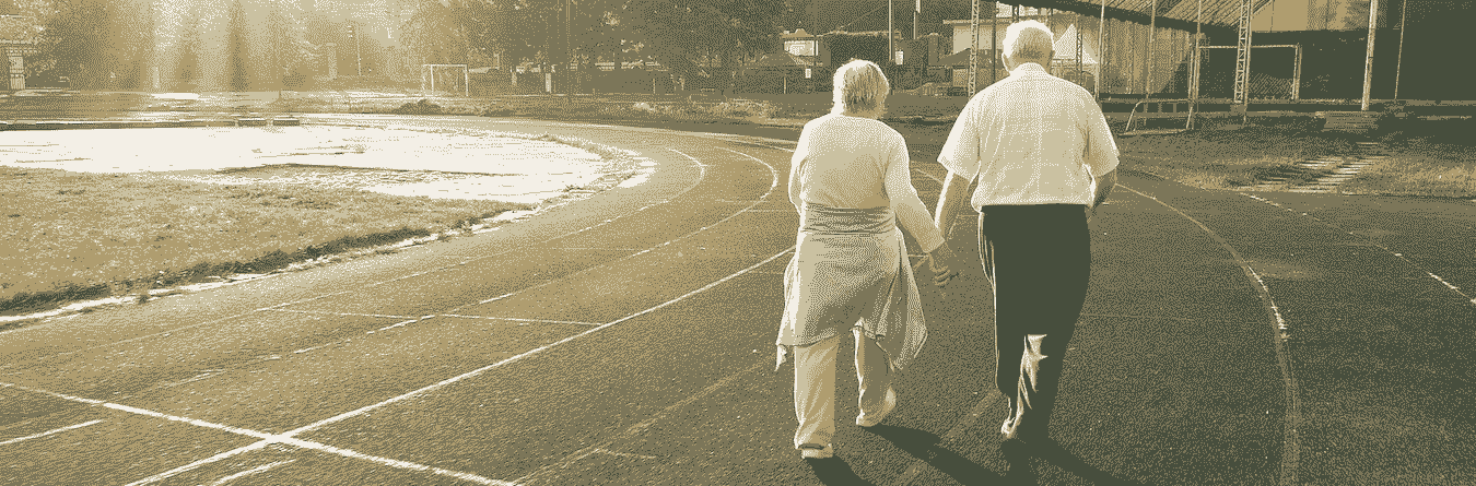 senior couple walking on track