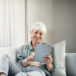 senior woman sitting on couch