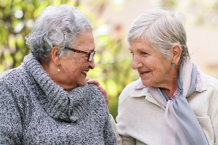 rhythms home care two senior women chatting rhythms home care two senior women chatting
