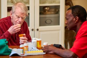 rhythms home care senior male client taking medication