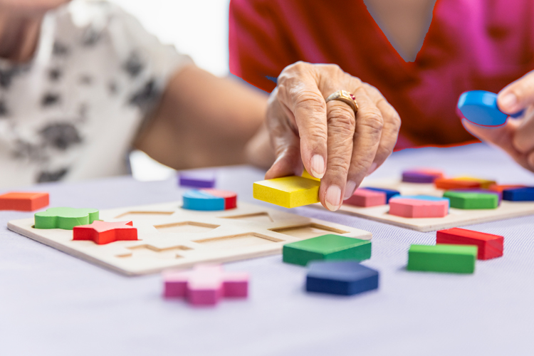 rhythms home care caretaker and client playing game