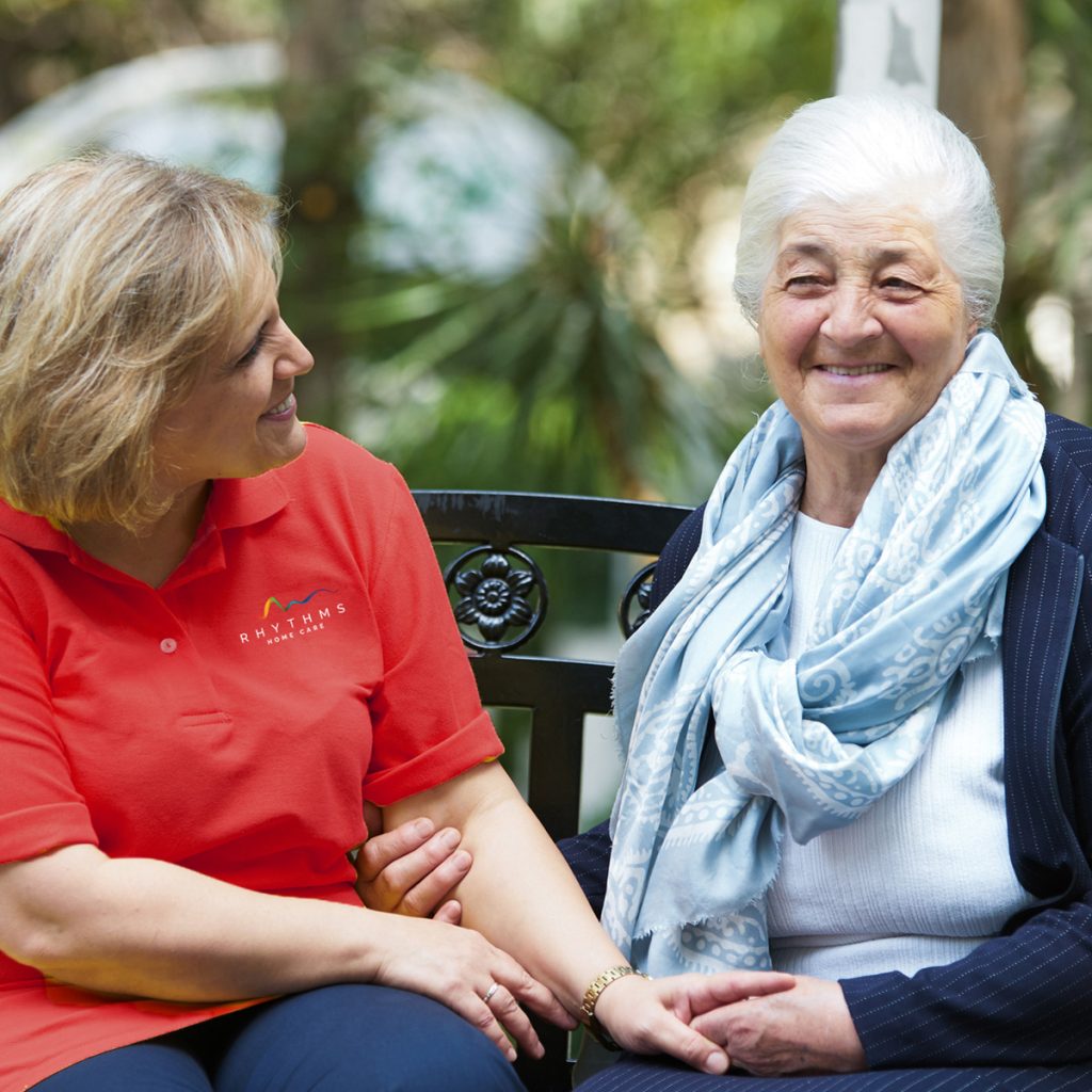rhythms home care female caregiver with senior woman